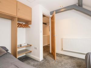 a bedroom with a door leading into a room at Richrose Chapel in Spalding