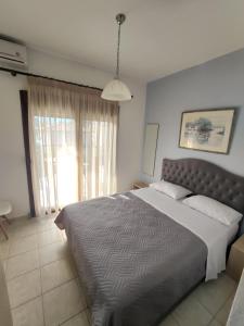 A bed or beds in a room at Angelo Studios