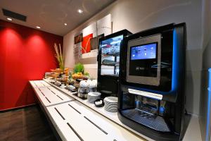 a computer sitting on top of a counter at Hôtel Foch in Tarbes