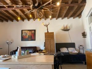 a living room with a couch and a table at LA GRANGE in Gien