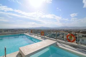 a swimming pool on the roof of a building at Dorian Inn - Sure Hotel Collection by Best Western in Athens
