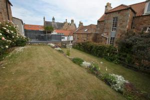 an empty yard in a city with buildings at Misty Morn- stunning home in East Neuk in Anstruther