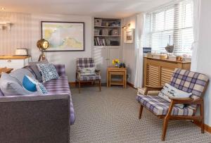 A seating area at East Pier View- stunning shorefront home