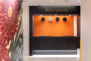 a display case in a store with clocks on it at Hotel Sanrriott Osaka Hommachi in Osaka