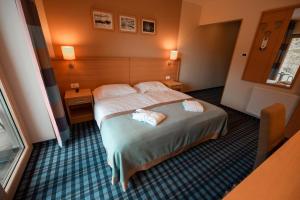 Katil atau katil-katil dalam bilik di Wellness Hotel Montis