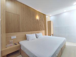 Postel nebo postele na pokoji v ubytování Thanh Hiền HB Hotel