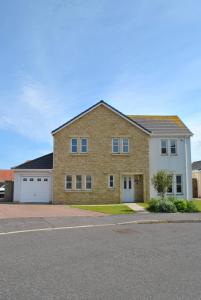 a large brick house with two garage at Faolin- superb detached family villa East Neuk in Anstruther