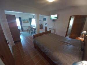 Ein Bett oder Betten in einem Zimmer der Unterkunft Quinta das Murteiras