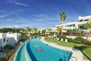 a view of a swimming pool in a resort at Puente Romano Luxury Villa in Marbella