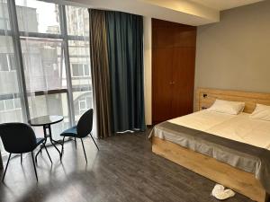 Postel nebo postele na pokoji v ubytování Friendly Hotel