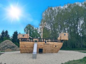 a model of a wooden boat in a park at Appartements Zur Auszeit in Waldkirchen
