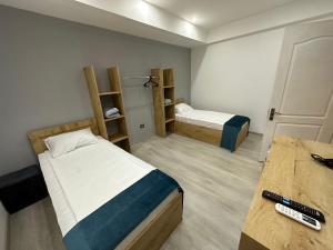 Voodi või voodid majutusasutuse Friendly Hotel toas