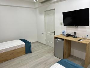 Voodi või voodid majutusasutuse Friendly Hotel toas