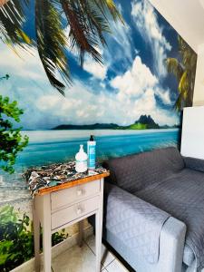a bedroom with a mural of the ocean at Come a casa tua in Falconara Marittima