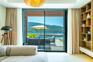 a living room with a view of the ocean at La Blanche Island Bodrum in Guvercinlik