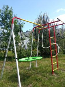 an empty playground with a swing at Szarga in Lubiatowo