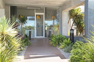 a front door of a house with plants at The Apollo in Apollo Bay