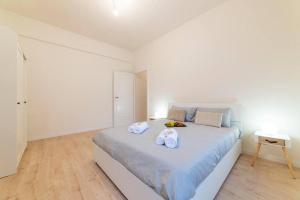 Postel nebo postele na pokoji v ubytování Gianicolo Cozy Suite