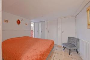 A bed or beds in a room at Appartement Chez Marie Thrse