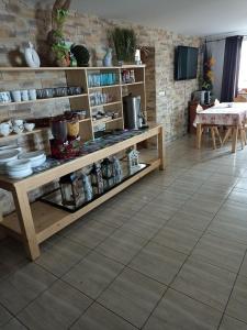 a room with a table and shelves with dishes at U Wyrostków in Gliczarów Górny