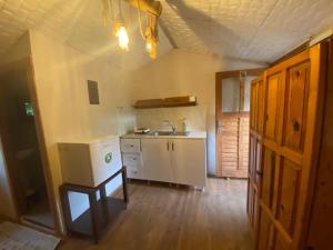 a small kitchen with a sink and a counter at Medusa Camping in Patara
