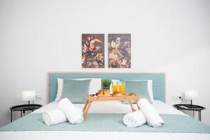 Ένα ή περισσότερα κρεβάτια σε δωμάτιο στο Athinais Suites