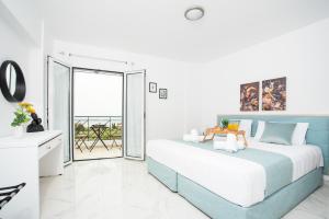 Ένα ή περισσότερα κρεβάτια σε δωμάτιο στο Athinais Suites