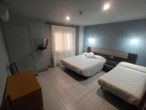 Krevet ili kreveti u jedinici u okviru objekta Hostal Can Jaume