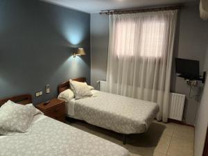 Krevet ili kreveti u jedinici u okviru objekta Hostal Can Jaume