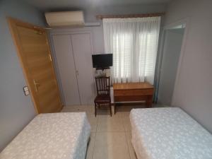 Krevet ili kreveti u jedinici u okviru objekta Hostal Can Jaume