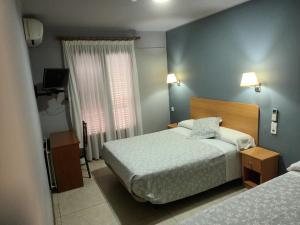 Llit o llits en una habitació de Hostal Can Jaume