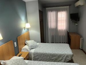 Krevet ili kreveti u jedinici u okviru objekta Hostal Can Jaume