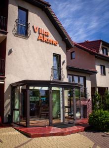 a building with a large glass door in front of it at Akme APARTMENTS&ROOMS in Gdańsk