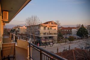 a view of a city from the balcony of a building at Likehome Apartments in Orestiada