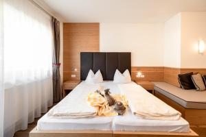 A bed or beds in a room at Hotel Rierhof