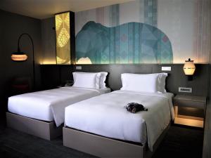 Cama o camas de una habitación en Bloom Hotel