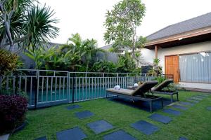 Ein Garten an der Unterkunft Sandi Agung Villa