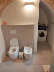 a small bathroom with a toilet and a sink at Il Terrazzino - località' Salve - Salento in Salve