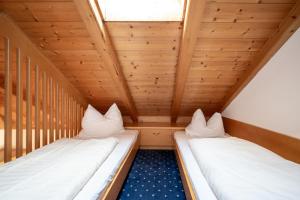 A bed or beds in a room at Hotel Rierhof