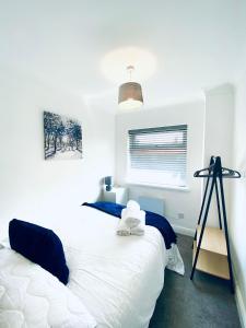 a bedroom with two white beds and a tripod at HU-Thirteen Loft Duplex Studio- Sleeps 2 in Hull