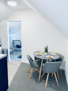 a dining room with a table and chairs at HU-Thirteen Loft Duplex Studio- Sleeps 2 in Hull