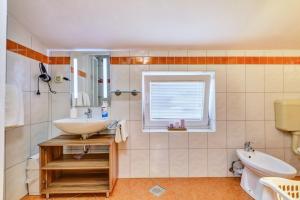 Koupelna v ubytování Apartment house UNA + 61 fotografií