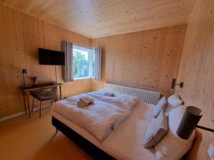 Postel nebo postele na pokoji v ubytování Skovsgård Hotel