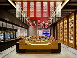 a grocery store with a display of fruits and vegetables at Grand Hyatt Jeju in Jeju