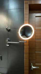a bathroom door with a round mirror on it at Delux apartment in Bansko for two in Bansko