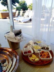 a tray of food on a table with a plate of food at Residence Maresol in Vieste
