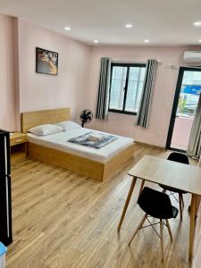 Ένα ή περισσότερα κρεβάτια σε δωμάτιο στο Aspire Saigon - Ly Tu Trong