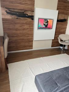 TV o dispositivi per l'intrattenimento presso Linhares Design Hotel