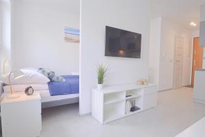 TV/Unterhaltungsangebot in der Unterkunft Sun Towers - Apartamenty Bryza - Apartamenty z parkingiem