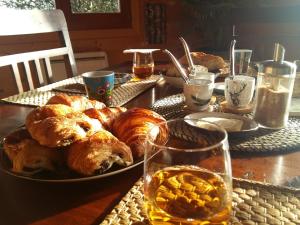 a table with a plate of pastries and drinks on it at Ecolodge Bellevue ALBI in Albi